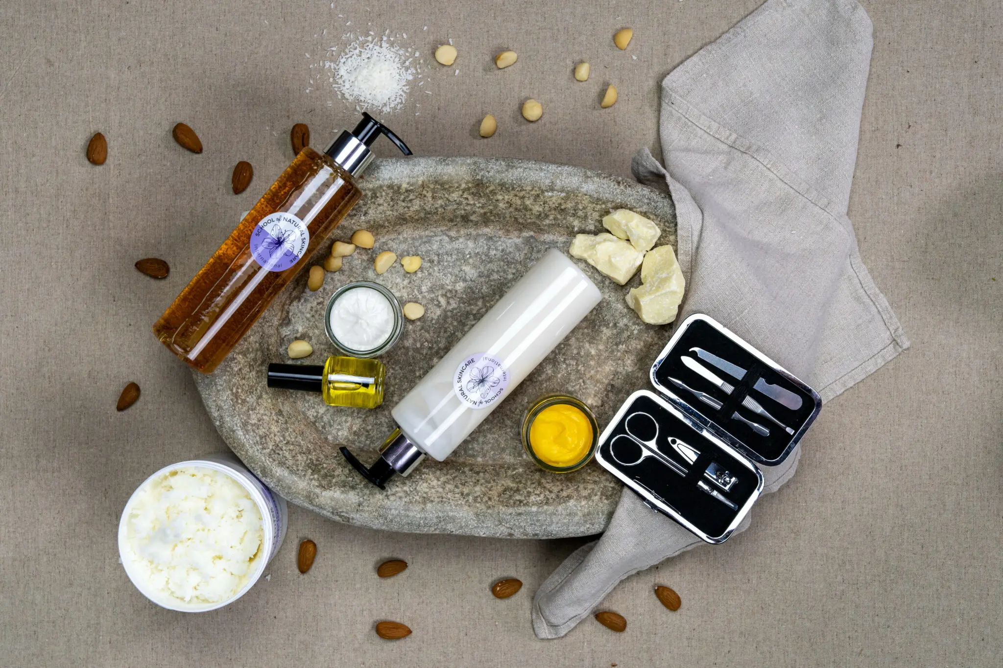 Natural skincare products with ingredients and tools on display.